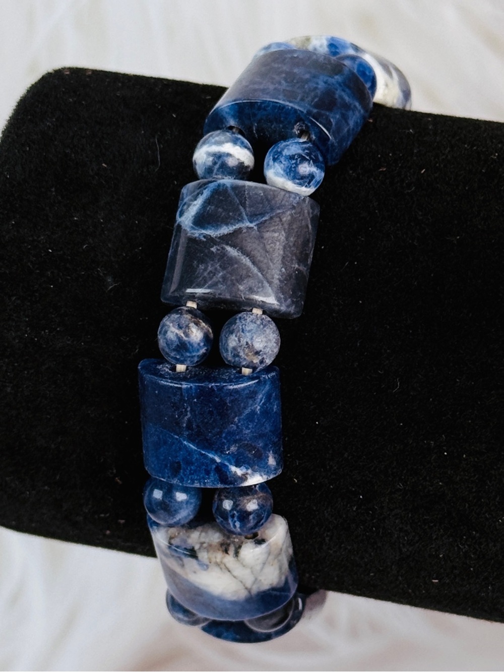 Gorgeous, blue weighted carved stone small stretch bracelet